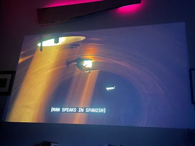 Light fixtures spaced along the top of what seems to be an arched tunnel
